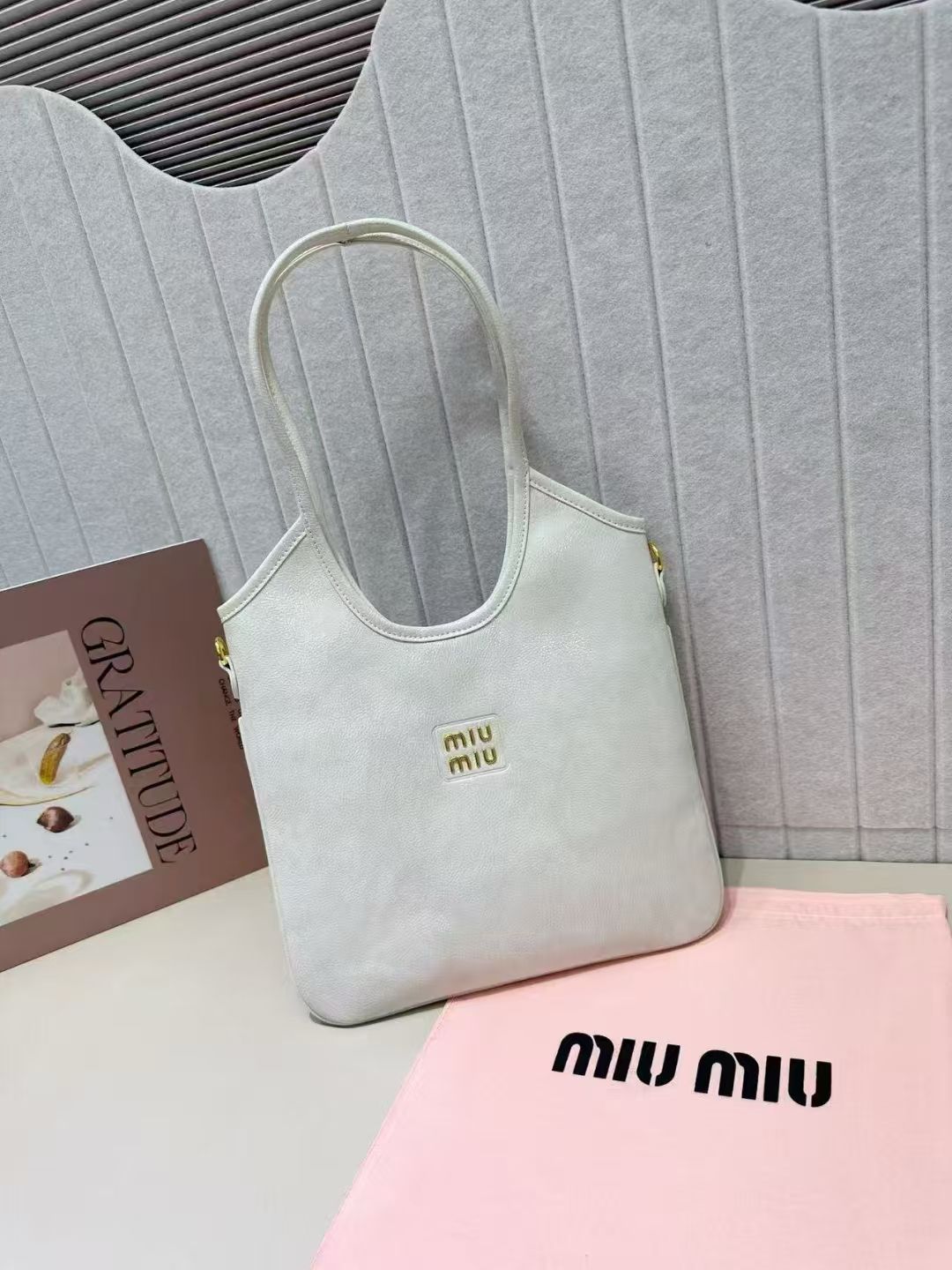 Cream white Miu Miu soft leather shoulder tote bag with gold logo