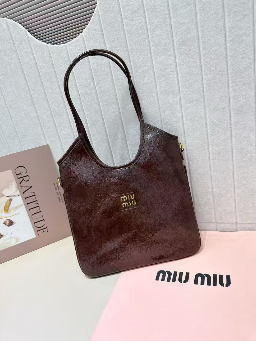 Dark espresso brown Miu Miu soft leather shoulder tote bag with long straps