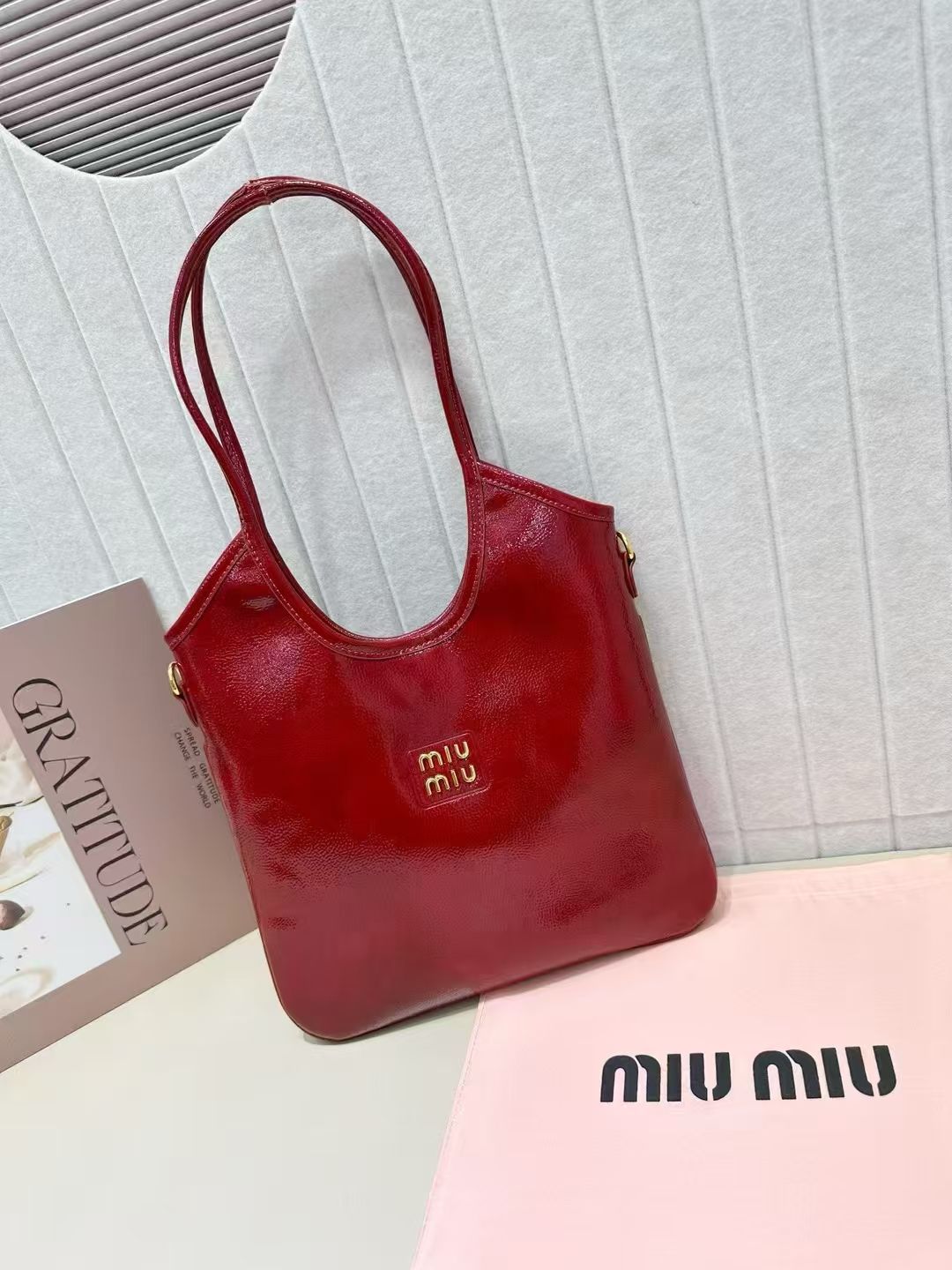 Deep red Miu Miu soft leather tote bag with long shoulder handles