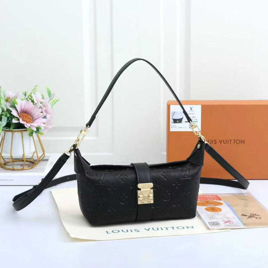 Black women’s monogram shoulder bag with adjustable strap