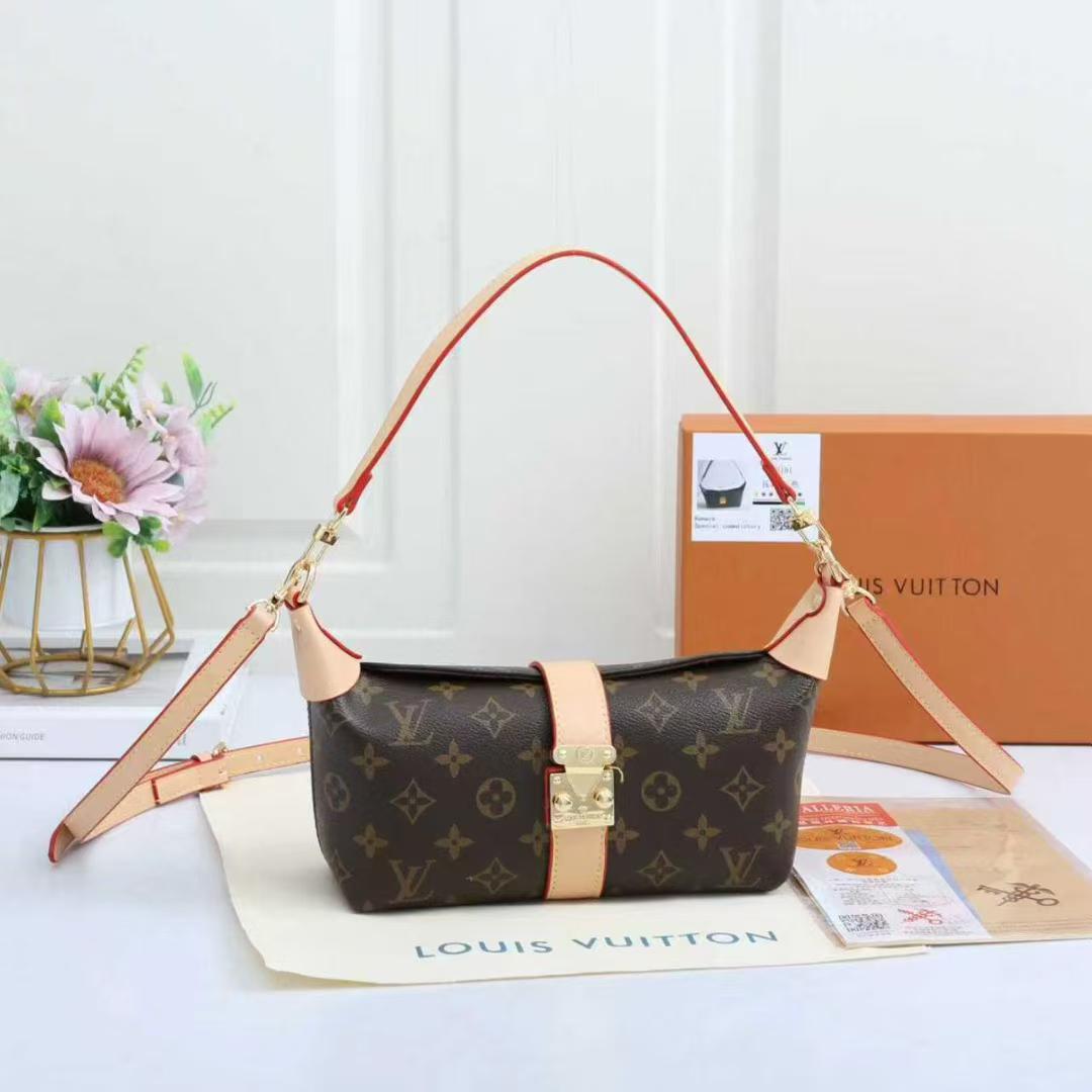 Women’s monogram shoulder bag with orange strap