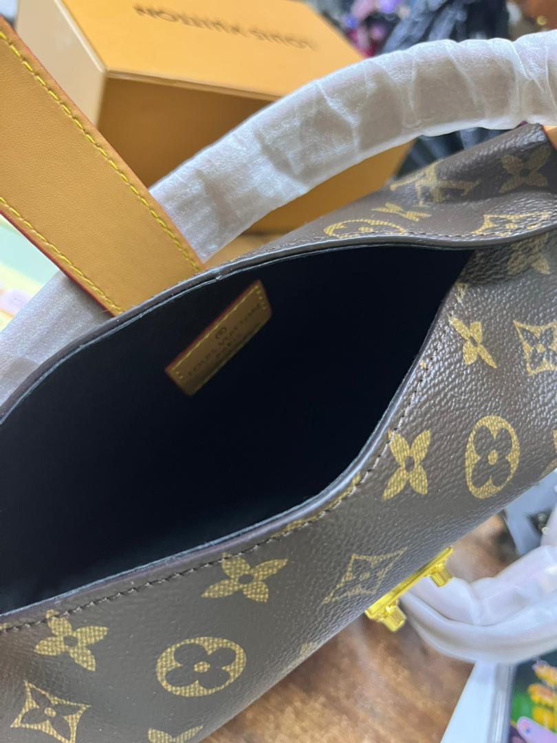 Louis Vuitton style monogram handbag interior with zipper compartment
