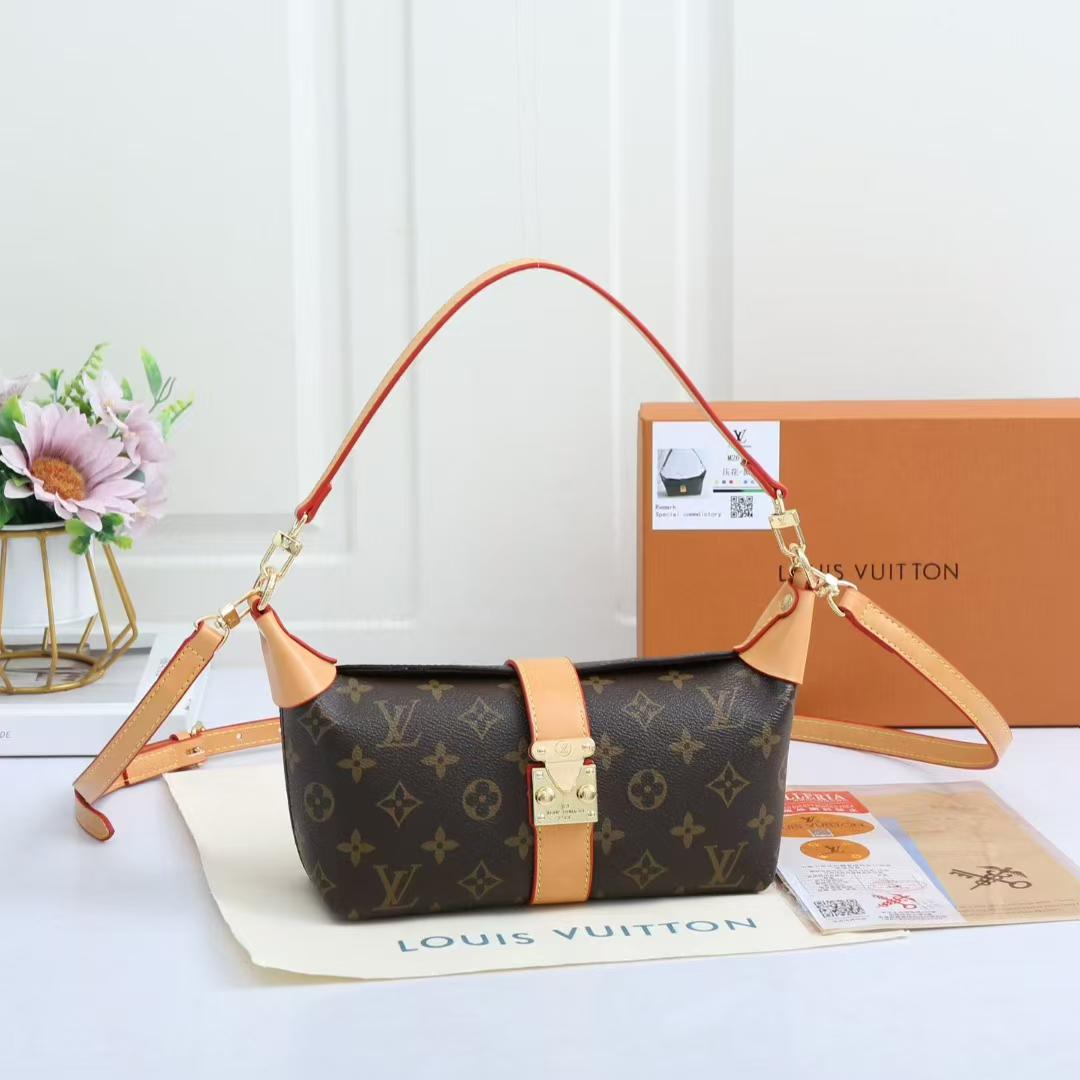 Monogram shoulder bag displayed with adjustable strap and front clasp