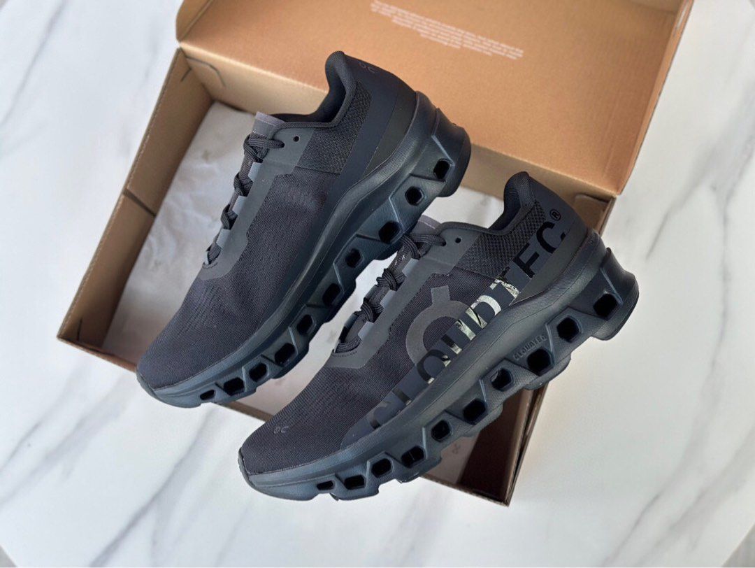 Pair of black and grey On Cloudmonster shoes