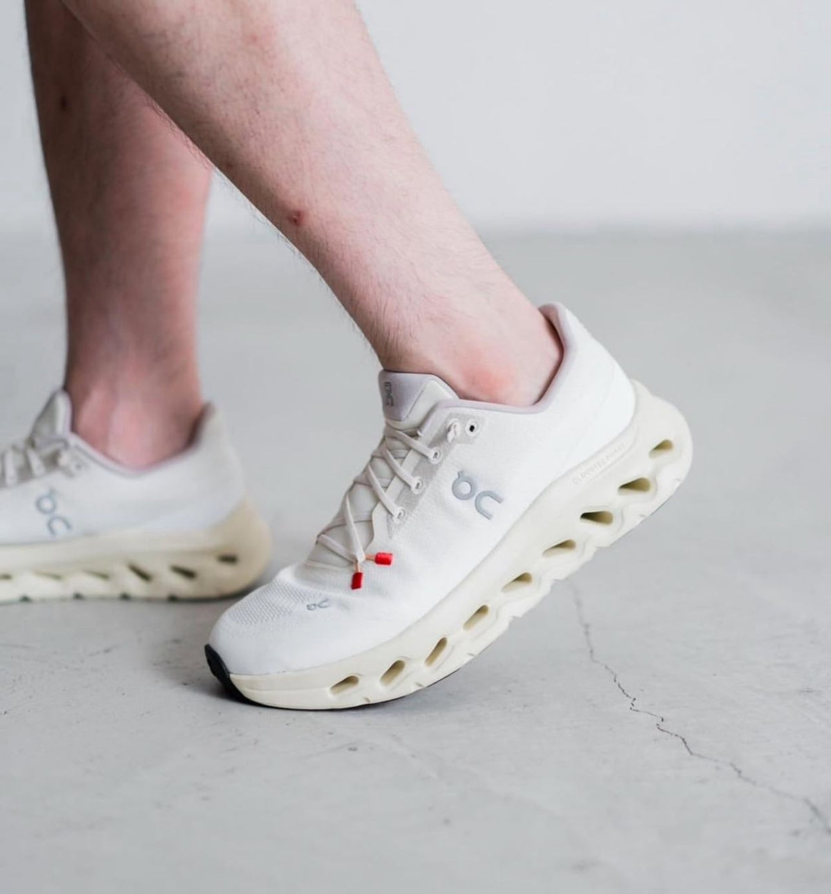 On Cloudtilt white ivory sneakers on feet