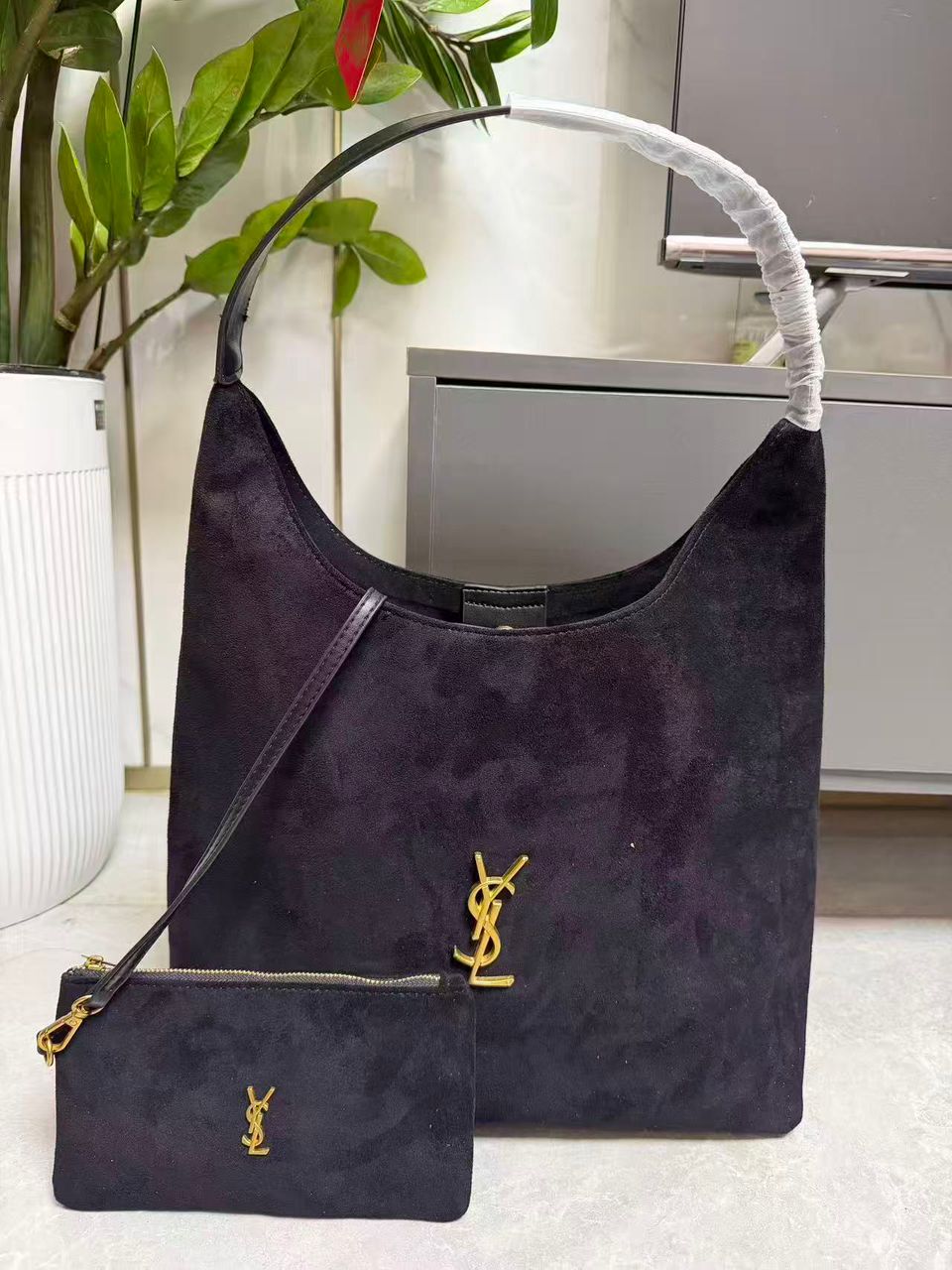 Purple YSL women’s hobo shoulder bag with pouch