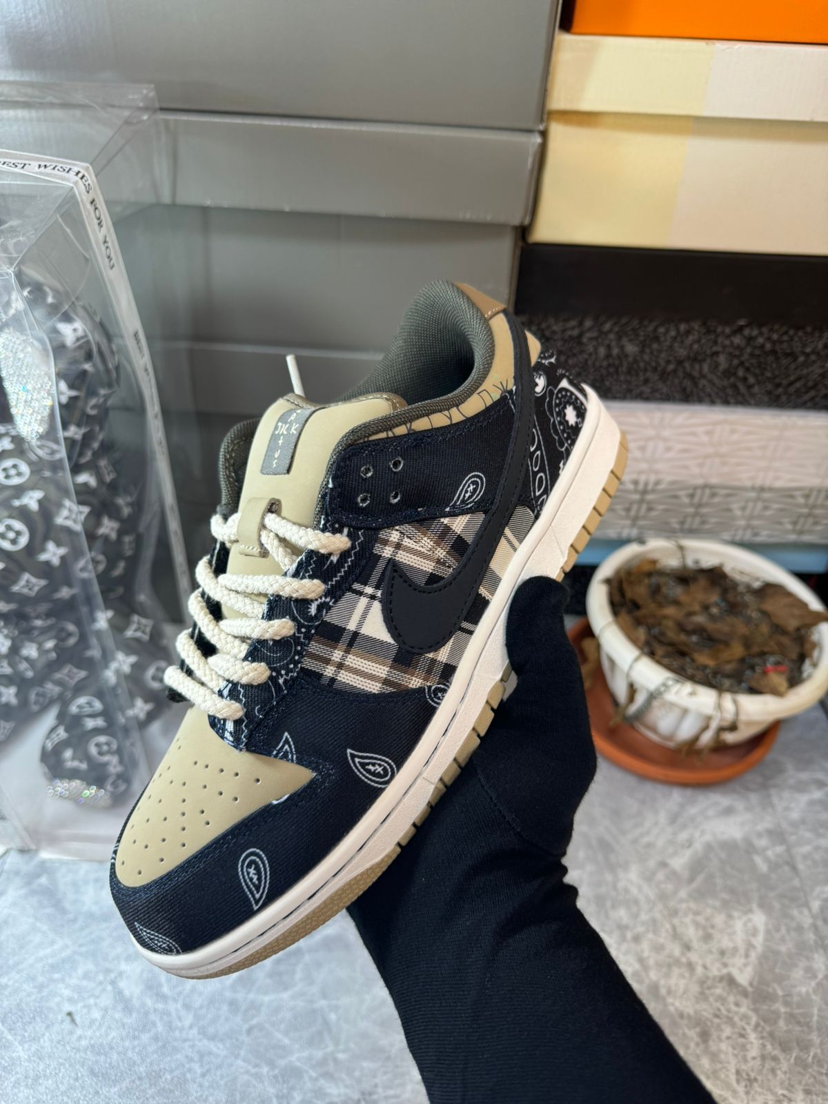 Travis Scott Nike SB Dunk Low Cactus Jack held in hand