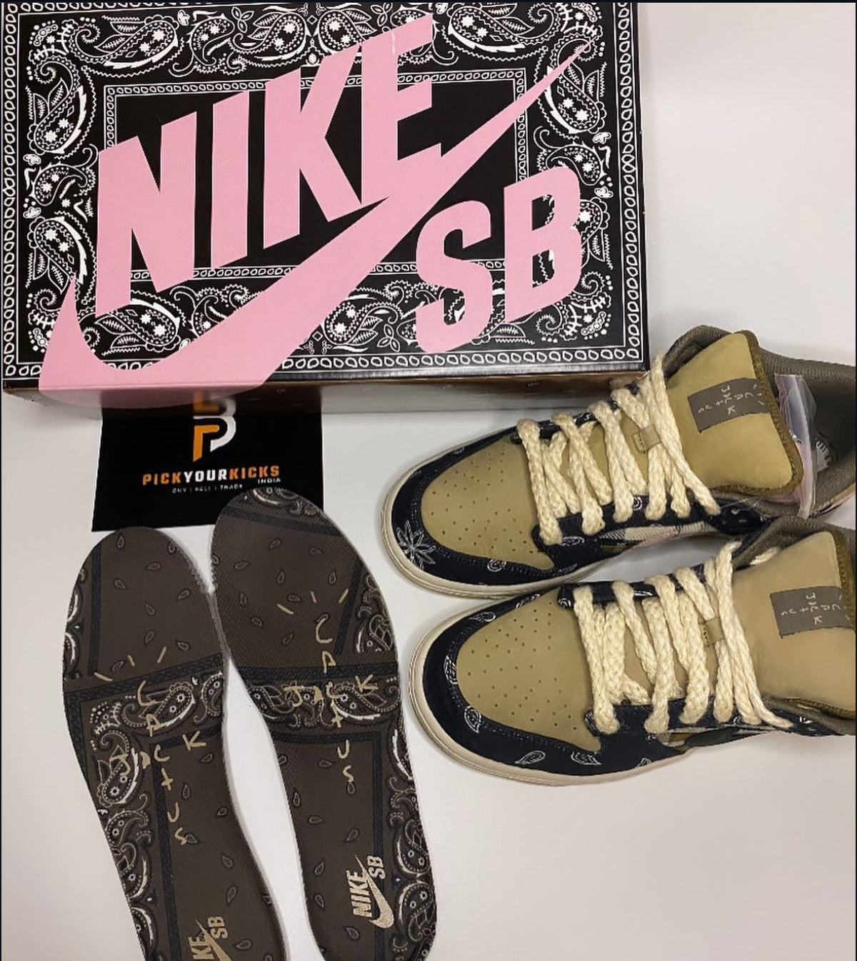 Travis Scott Nike SB Dunk Low shoes displayed with box