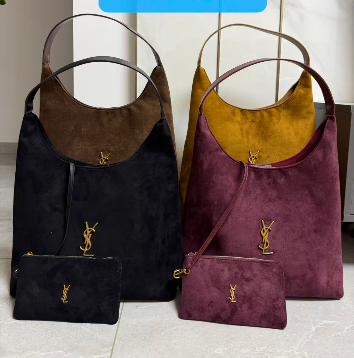 Black and mustard YSL hobo bags with matching pouches